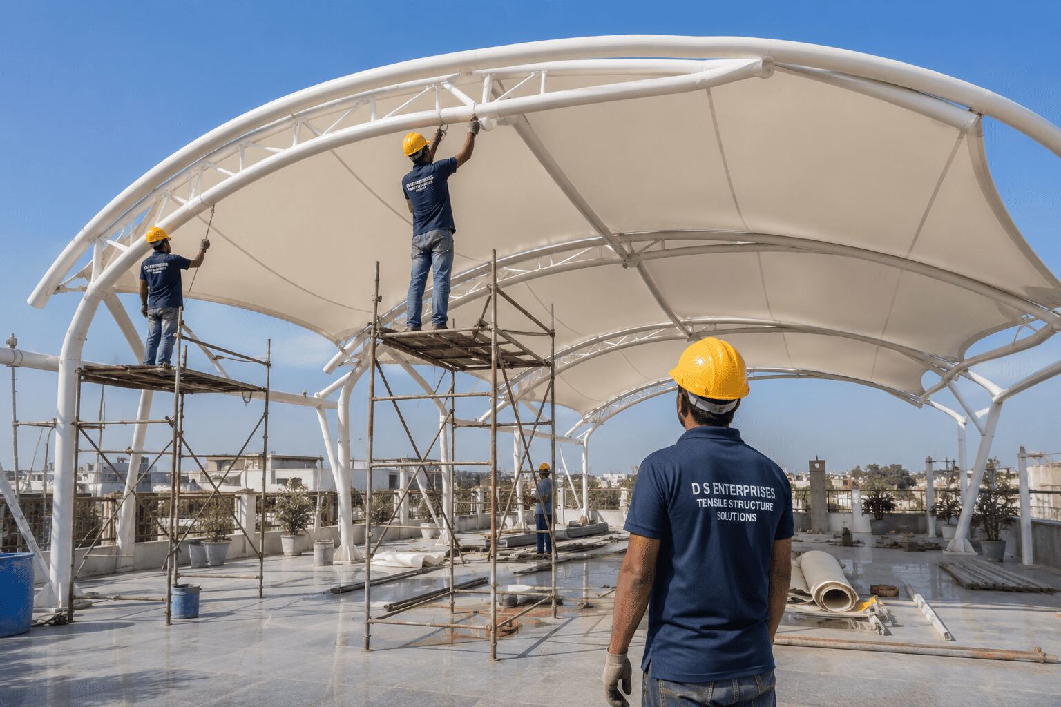 D S Enterprises team installing a tensile fabric roof